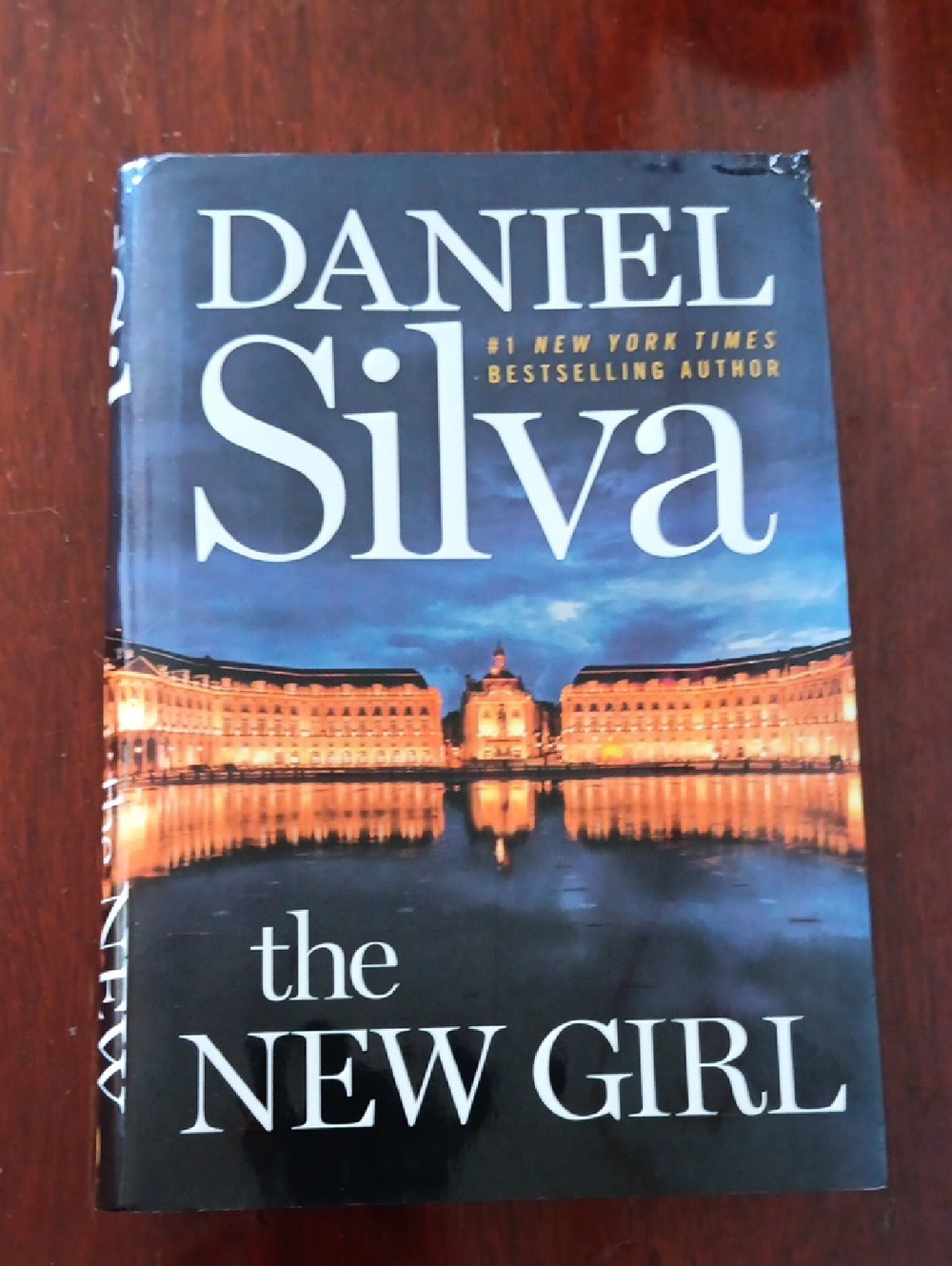 Daniel Silva "The New Girl" Hardcover Book - Blue & Gold Cover